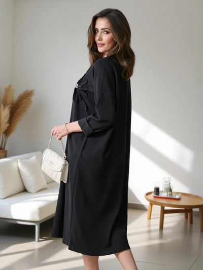 Royalfashion Ženska midi obleka iz materiala oversized s cvetom