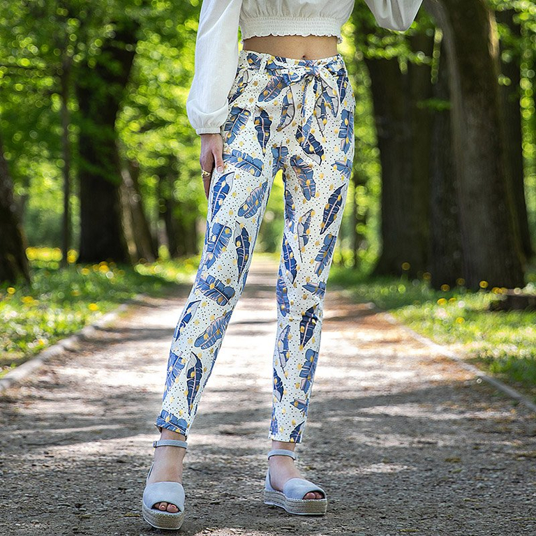Royalfashion Białe damskie tregginsy w piórka