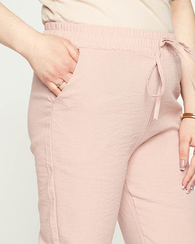 Royalfashion Damskie różowe spodnie materiałowe typu joggery PLUS SIZE