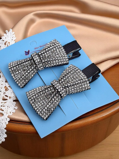 Royalfashion Set dveh lasnih sponk z mašnicami in kristalčki Isadora