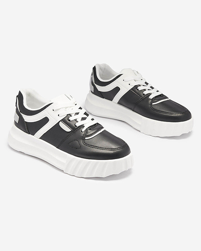 Royalfashion Eko-skórzane damskie czarne casualowe buty sportowe z białymi wstawkami Netiris