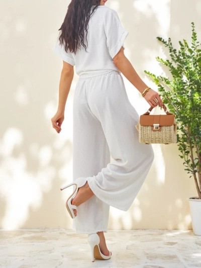 Royalfashion Ženski set z zavezanimi kratkimi rokavi in razširjenimi hlačami z diamanti