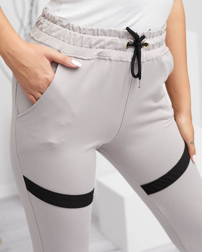 Royalfashion Damskie spodnie dresowe w kolorze jasnoszarym