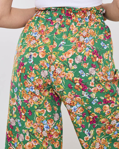 Royalfashion Damskie zielone spodnie typu palazzo w pomarańczowe kwiaty