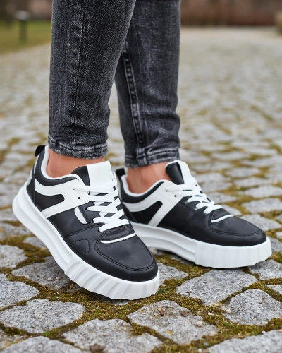 Royalfashion Eko-skórzane damskie czarne casualowe buty sportowe z białymi wstawkami Netiris