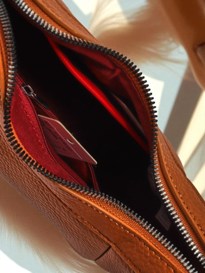 Royalfashion Malá dámska kabelka z ekologickej kože s ozdobným opaskom Lacquea