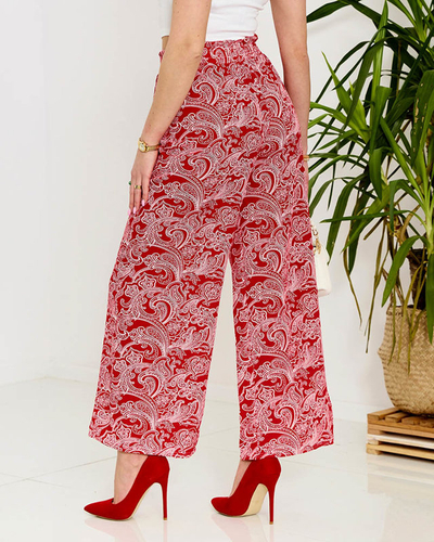 Royalfashion Czerwone damskie spodnie materiałowe z printem