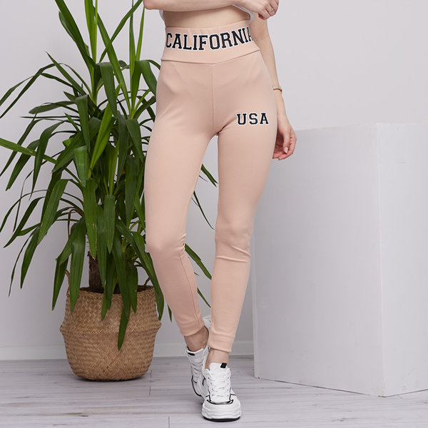 Royalfashion Beżowe damskie prążkowane legginsy z napisami