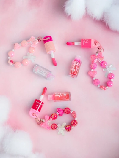 Otroški lip gloss z zapestnico Brezbarven