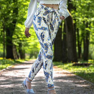Royalfashion Białe damskie tregginsy w piórka