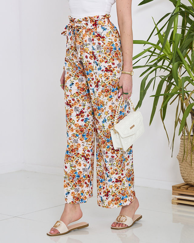 Royalfashion Damskie białe spodnie typu palazzo w pomarańczowe kwiaty