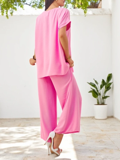 Royalfashion Ženska kratkoročnica s dekorativnim cvetom in širokimi hlačami