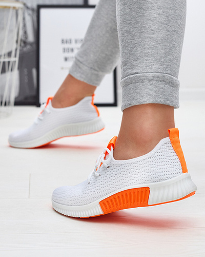 Royalfashion Białe damskie buty sportowe z pomarańzowymi wstawkami Kedeti