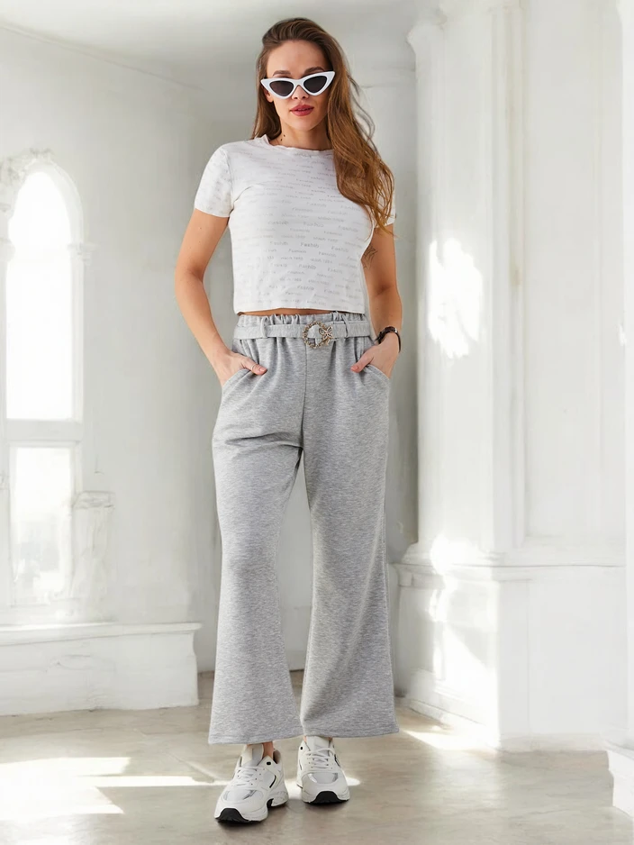 Royalfashion Široke ženske hlače iz tkanine z okrasnim pasom