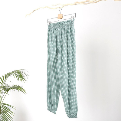 Royalfashion Zielone damskie spodnie materiałowe w groszki PLUS SIZE