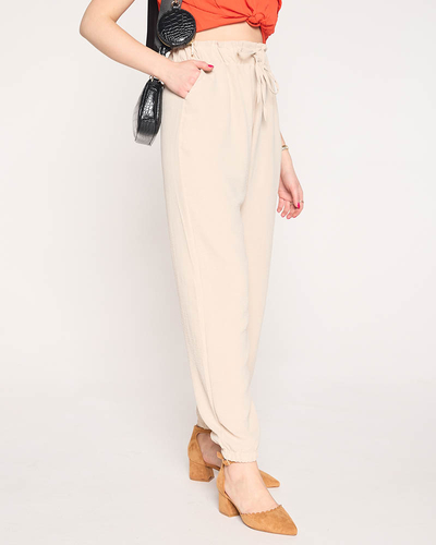 Royalfashion Materiałowe damskie spodnie w kolorze beżowym PLUS SIZE