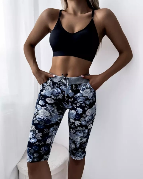 Royalfashion Niebieskie damskie spodenki 3/4 z kwiatowym wzorem PLUS SIZE