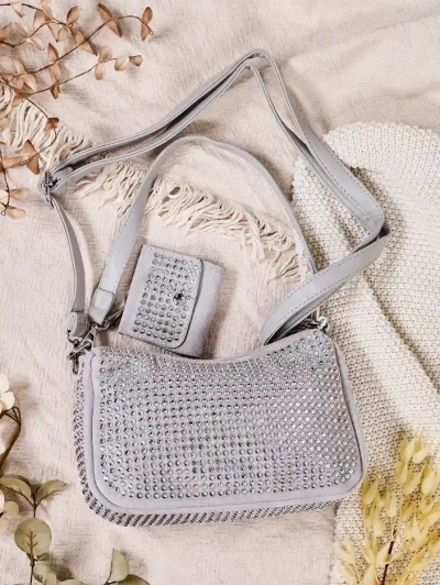 Royalfashion Mala ženska torba s zakovicami