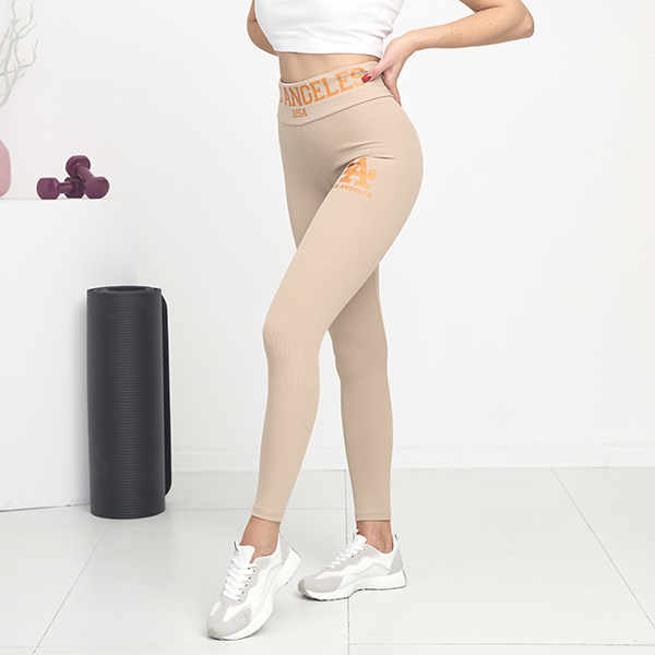 Royalfashion Jasnobrązowe damskie prążkowane legginsy z pomarańczowymi napisami