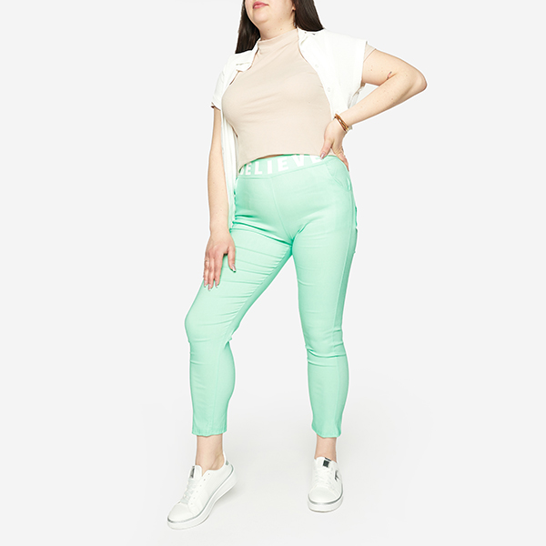 Royalfashion Miętowe damskie spodnie materiałowe z napisem PLUS SIZE